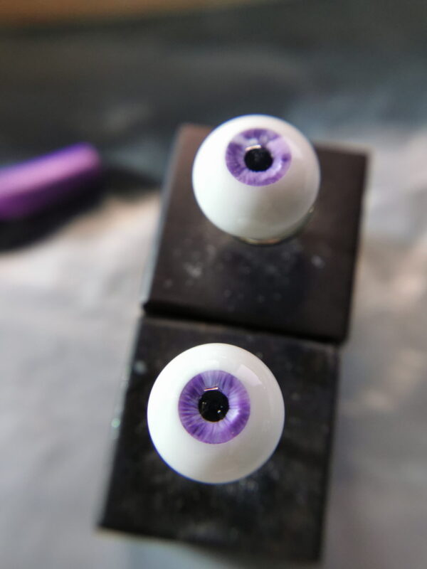 Purple BJD doll eye with nicks