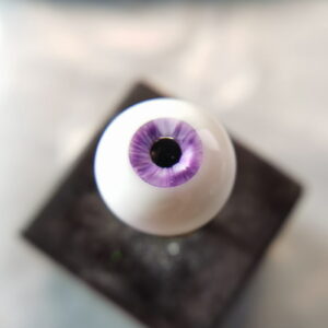 Purple BJD doll eye with nicks