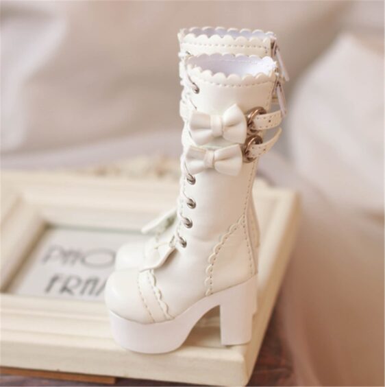 a white boot with bows on it