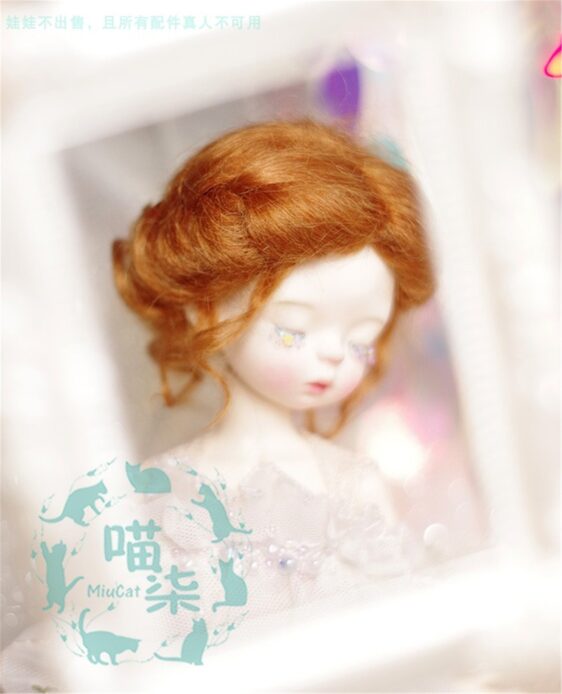 a doll with red hair