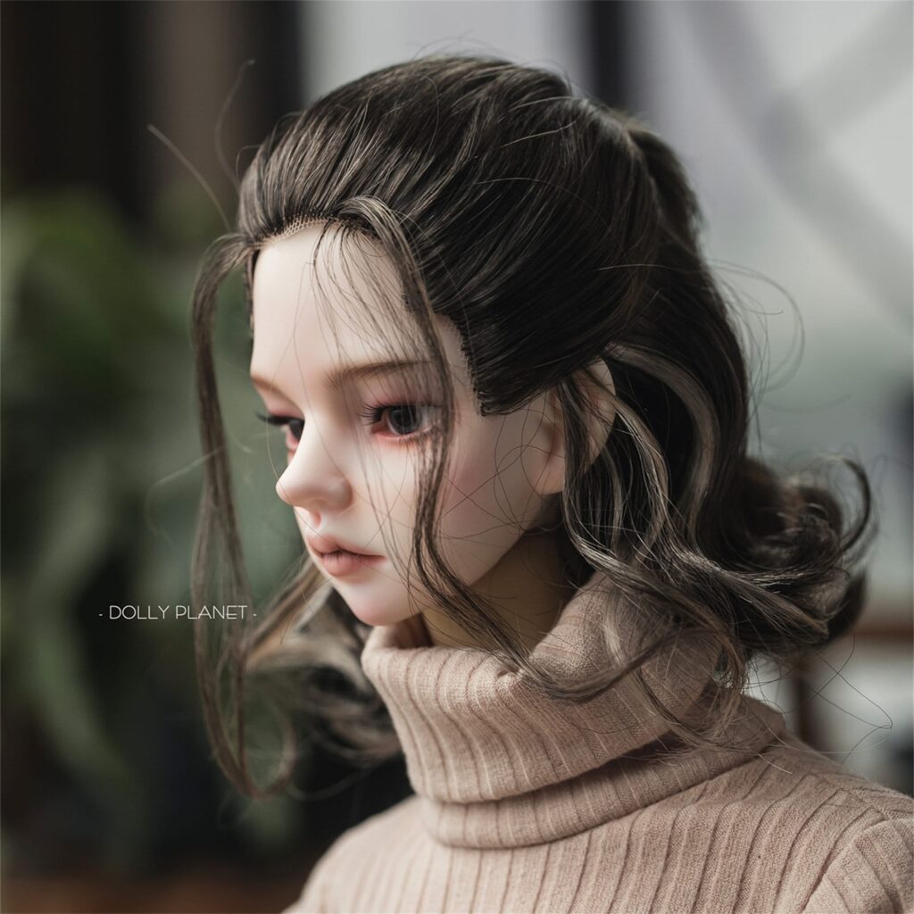 a doll head with a turtleneck sweater