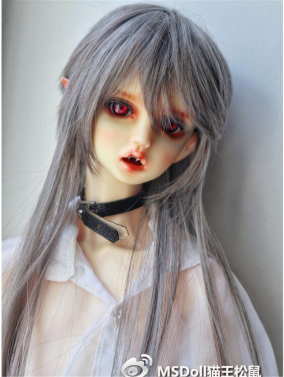 a doll with red eyes and long hair