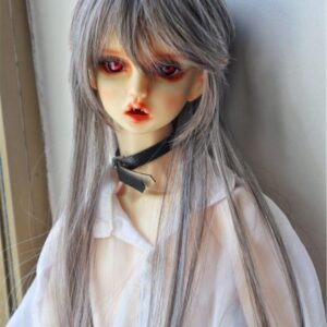 a doll with red eyes and long hair