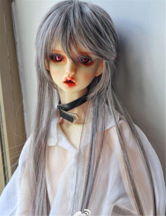 a doll with red eyes and long hair